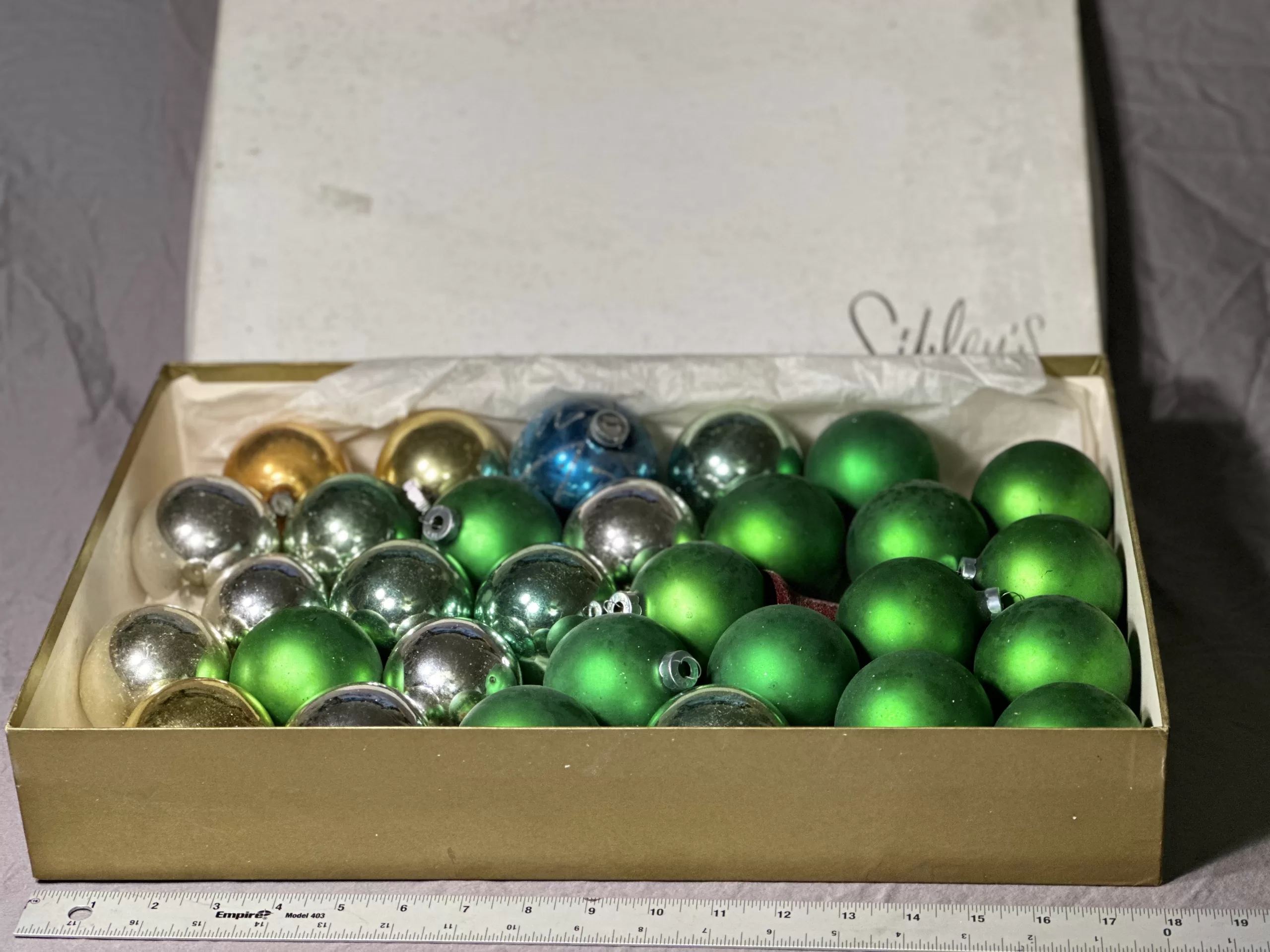 Box of assorted vintage glass Christmas ornaments from Sibley’s.