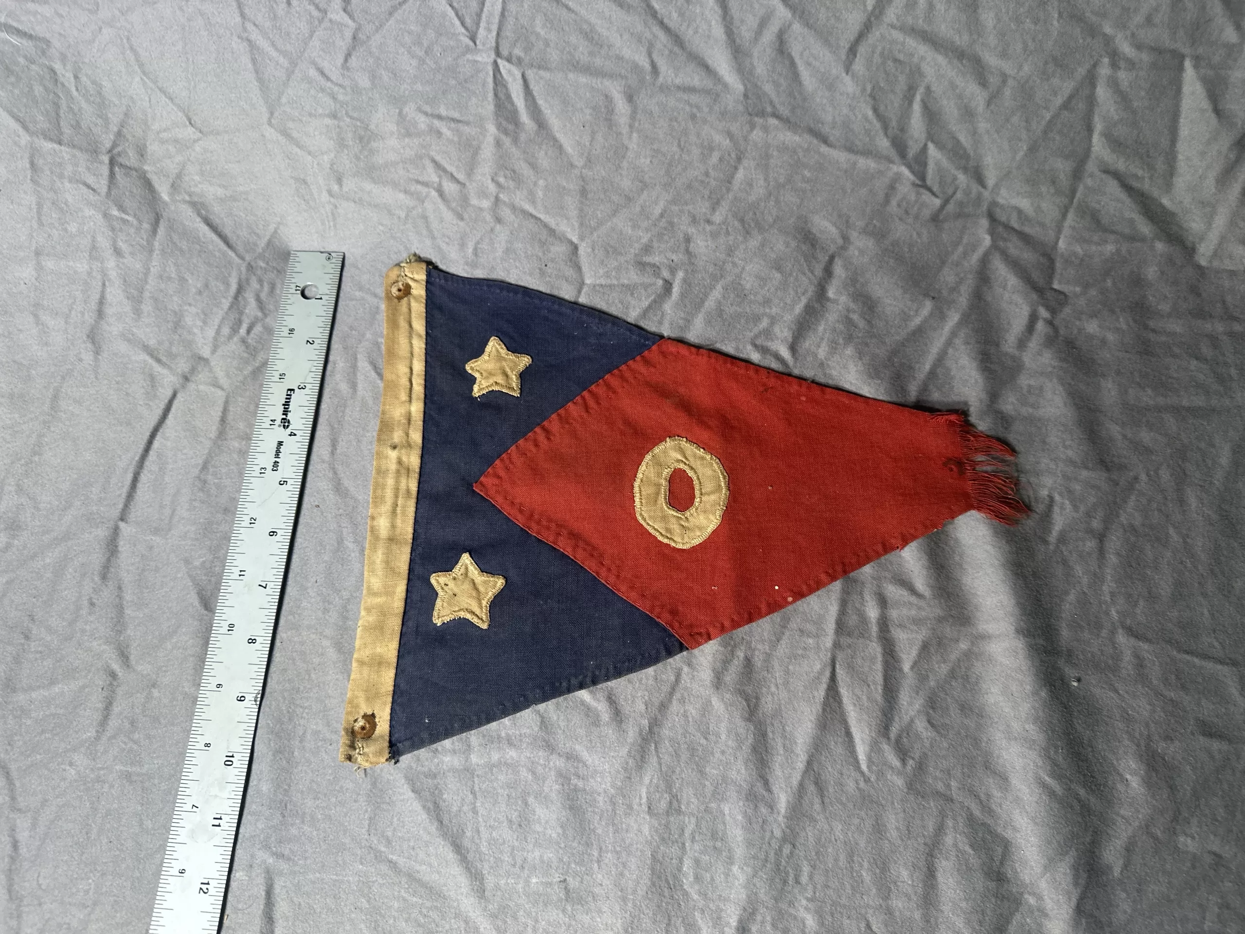 Front view of vintage personal battle flag with stars and red diamond.